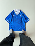 Front view of the retro Brazil 1994 World Cup away jersey in royal blue featuring a white overlap collar and sublimated CBF crest patterns at vamstore India.