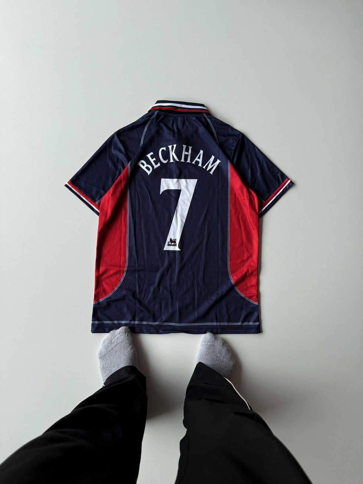 Back view flat lay of the vintage Manchester United 2002 2003 third jersey showcasing David Beckham's iconic white number 7 nameset and classic sponsor at vamstore India.