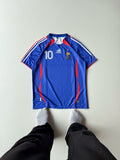 Front view flat lay of the retro France 2006 World Cup home jersey in royal blue featuring the classic Teamgeist template with red and white contour piping at vamstore India.