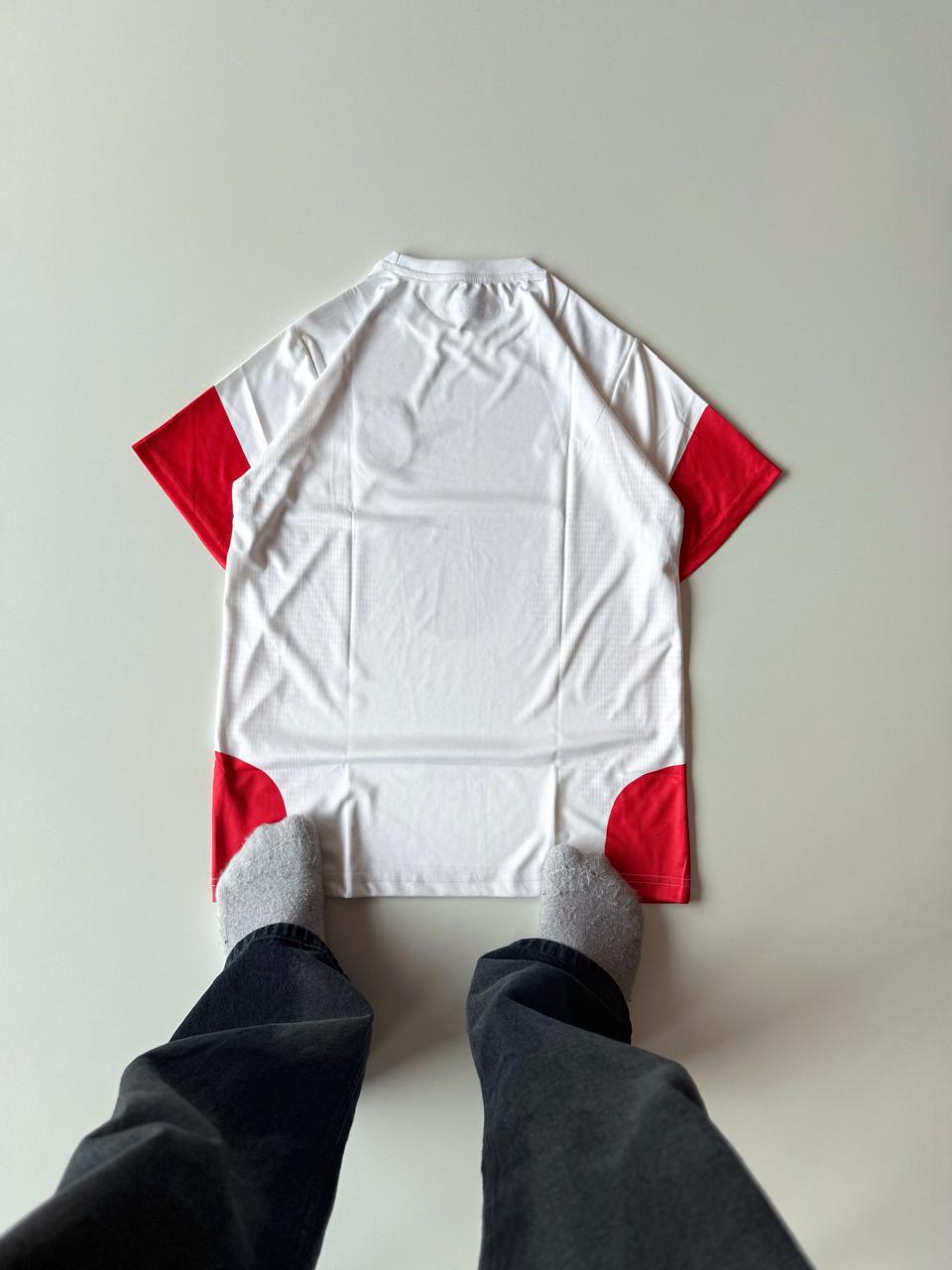 Back view flat lay of the Germany 2024 home jersey showcasing the clean white template and red lower-side mesh trim at vamstore India.