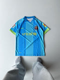 Barcelona 2006 2007 away jersey in vibrant light blue featuring textured vertical stripes and high density embroidered club crest at vamstore India.