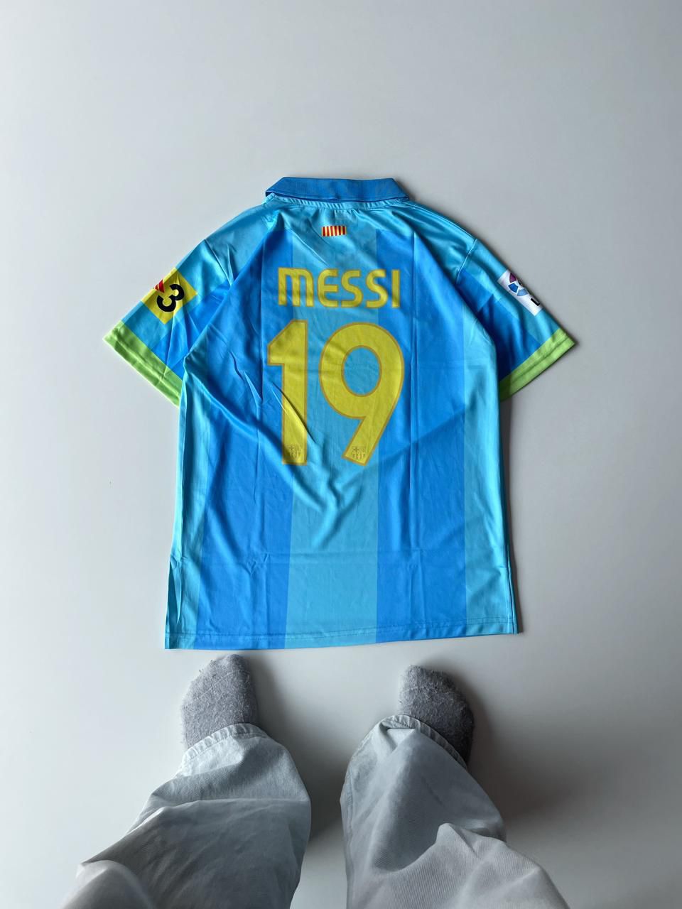 Back view of the Barcelona 2006 2007 away jersey showcasing Lionel Messi's historic number 19 yellow nameset and classic Unicef sponsor print at vamstore India.