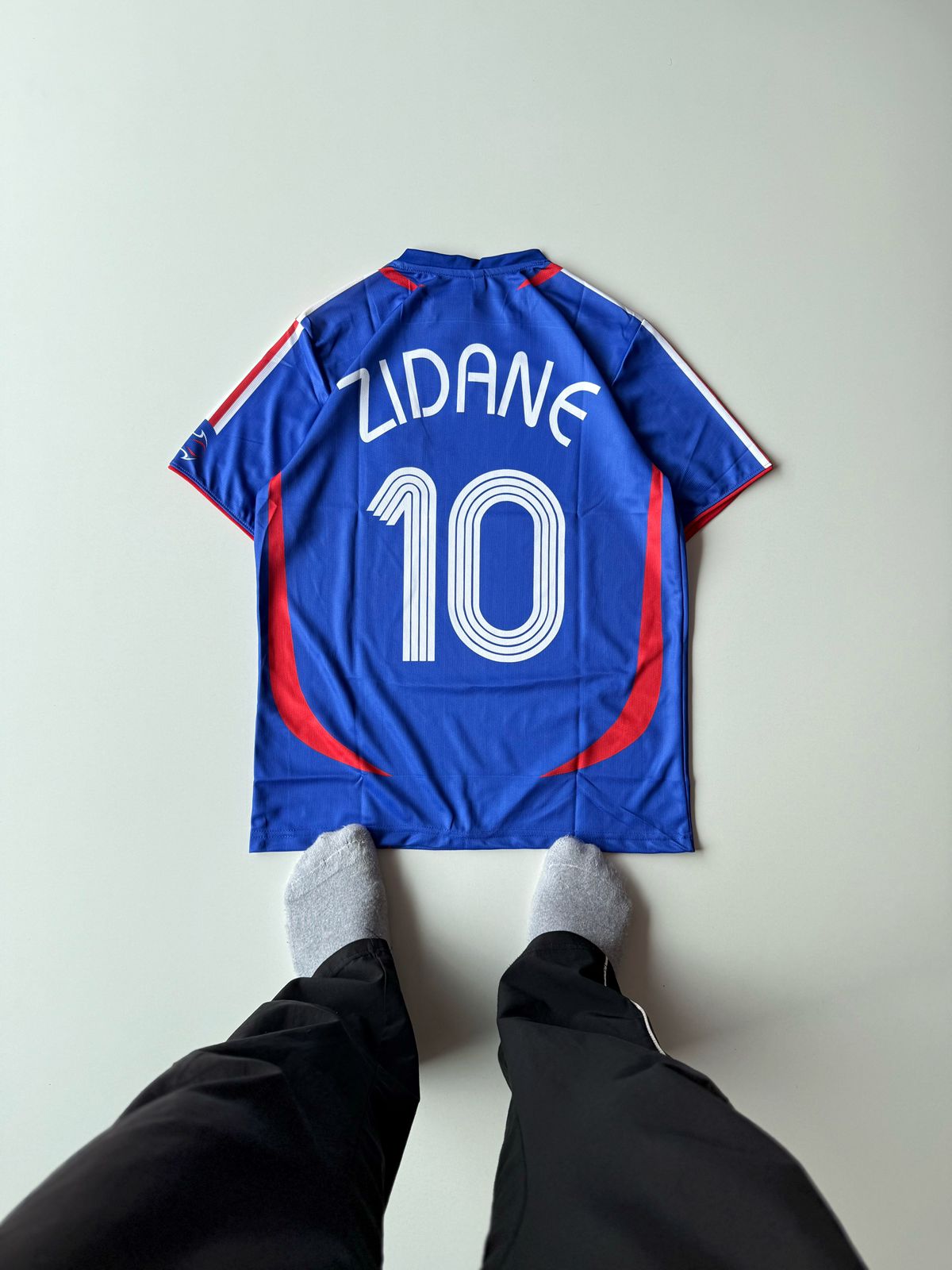 Back view flat lay of the retro France 2006 World Cup home jersey showcasing Zinedine Zidane's legendary arched number 10 nameset layout at vamstore India.