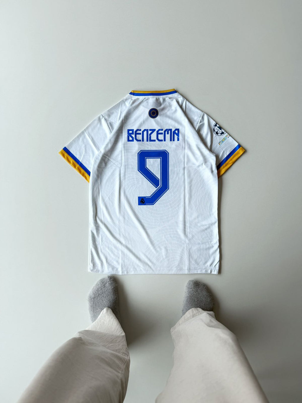 Back view of the Real Madrid 2021 2022 UCL Final Paris home jersey featuring Karim Benzema's blue number 9 nameset layout at vamstore India.